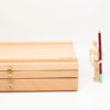 Mont-Marte-Artists-Pastel-Box-front-view-with-manikin-standing-next-to-it