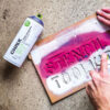 Montana-Chalk-Spray-Paint-Bottle-on-Gravel-Using-Stencles