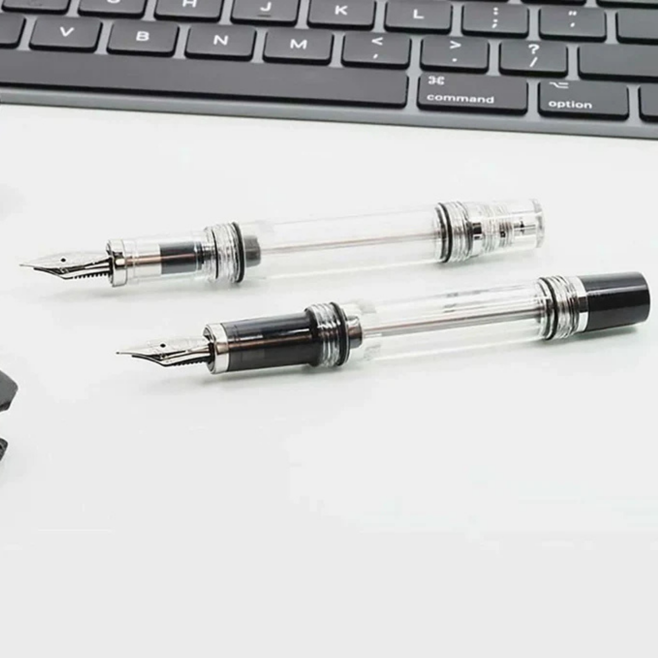 TWSBI VAC MINI FOUNTAIN PENS on table